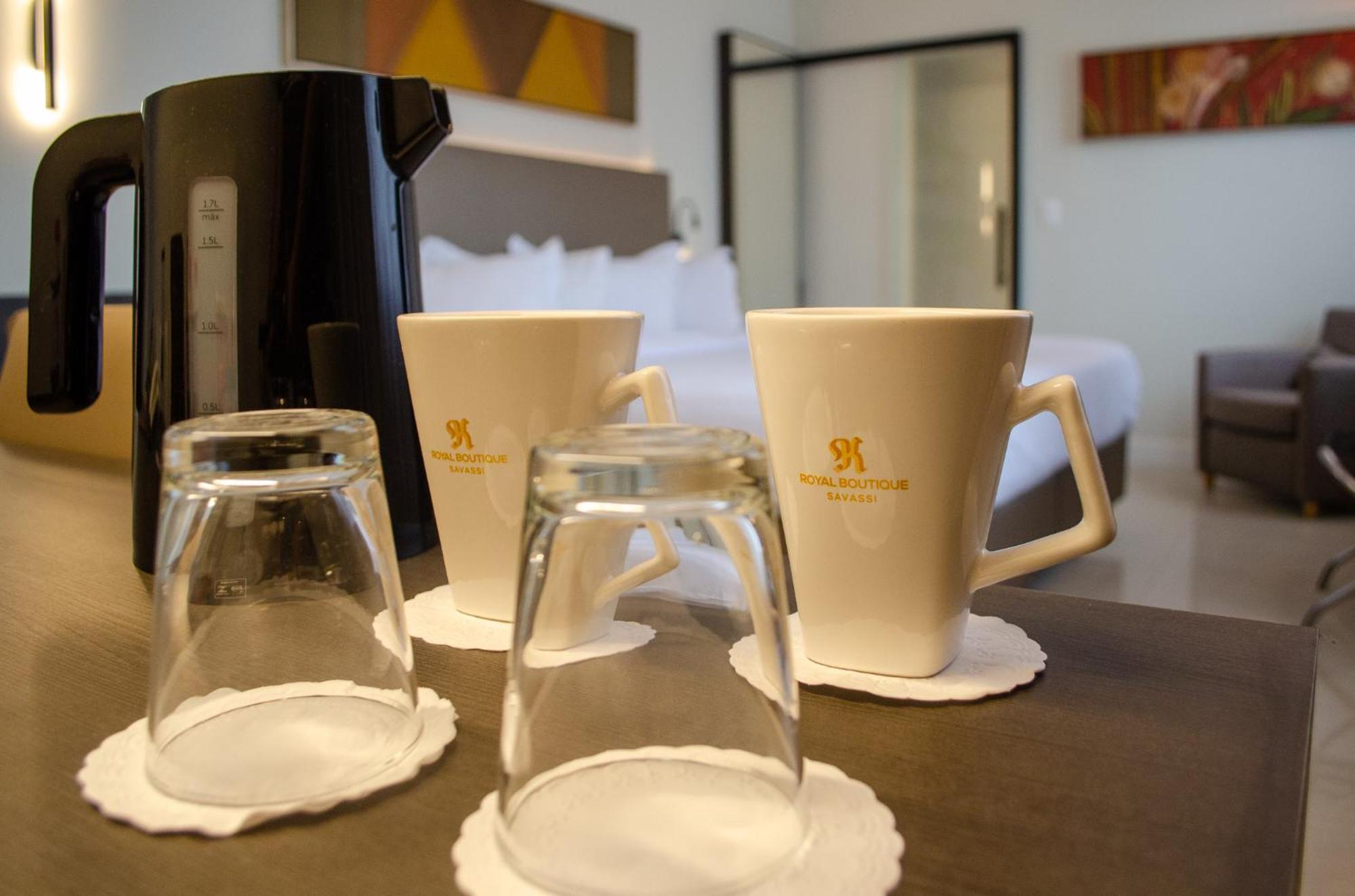 Royal Boutique Savassi Hotel Belo Horizonte Bagian luar foto A coffee pot and two cups